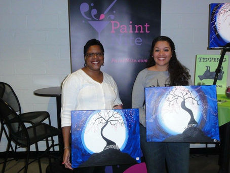 Jazmyne Danielle and Auntie showing their creations from Paint Nite.