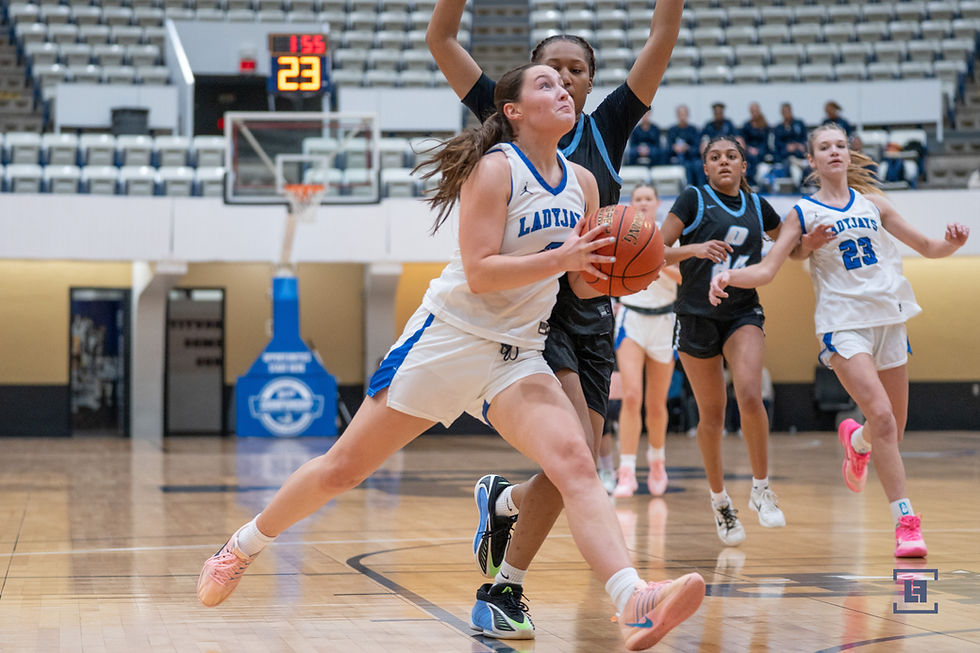 Izzy Klumper goes strong to the hoop.