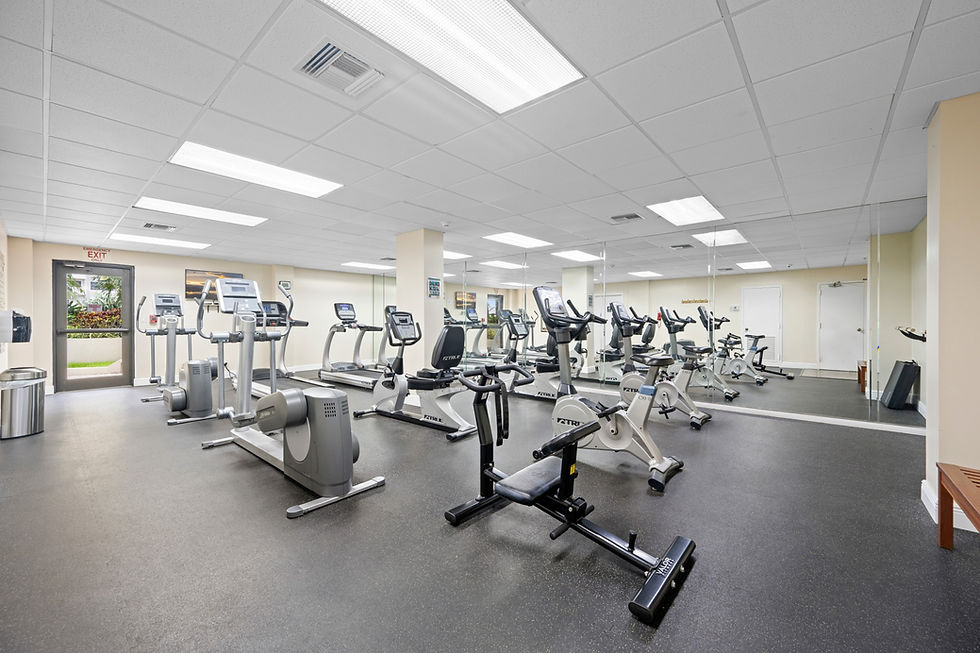 Modern fitness center with cardio equipment at Sea Ranch Club beachfront resort