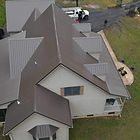 An aerial view of a Residential Roof that TNT Roofing and Restoration built. This image was taken after the work was done and was taken from a drone.