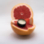 Balm resting on grapefruit