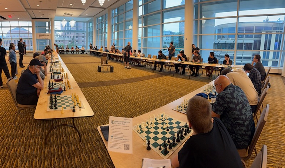 57 player simultaneous exhibition with IMs Nagle and Bartholomew. Photo by Jiten Patel.