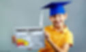 a speech therapy student smiling while holding a graduation certificate
