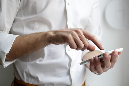 A smartphone users holding their phone and scrolling