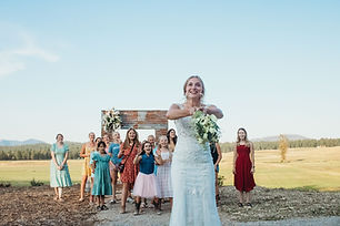 bride tossing bouquet