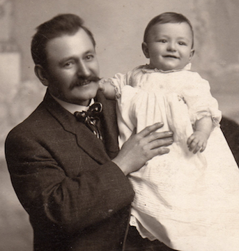 Father Alois holding son Robert