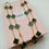 Thumbnail: Golden Green 20 Clover Necklace 