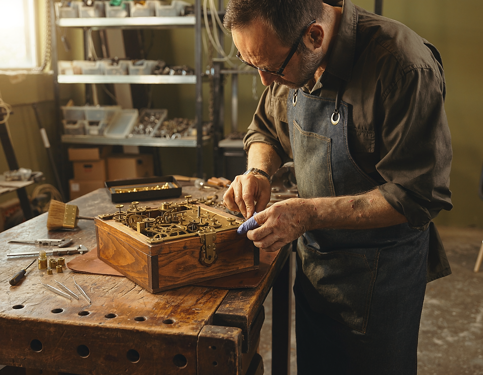 Escape-room technician repairing a handmade mechanical puzzle in the prop workshop.