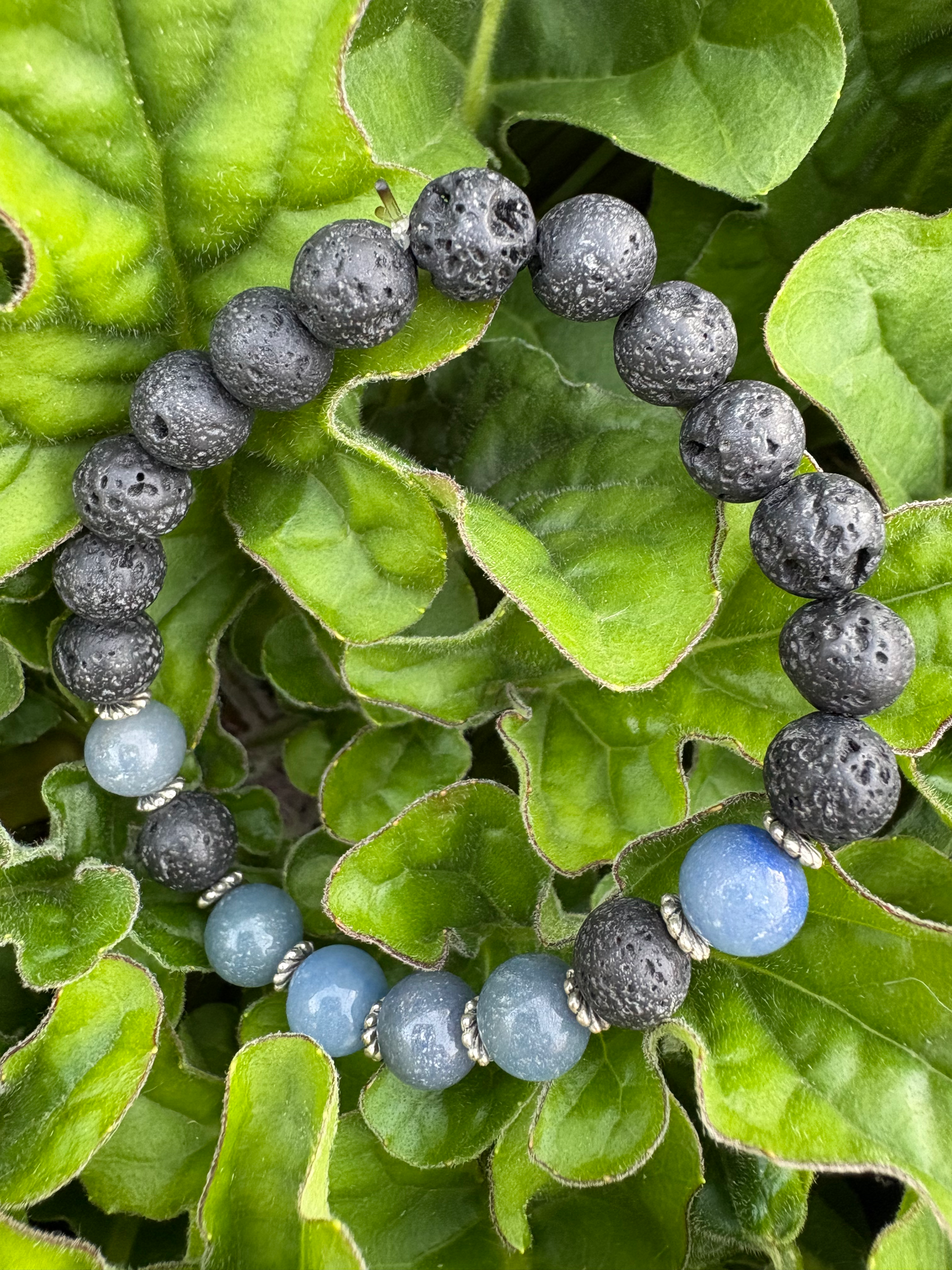 Black Lava Chakra Bracelet with blue aventurine (blue) beads and silver toned spacer beads.