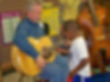 Student examining guitar