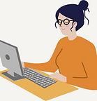 An assistant with black hair wearing glasses and an orange jumper sat at a desk on her com