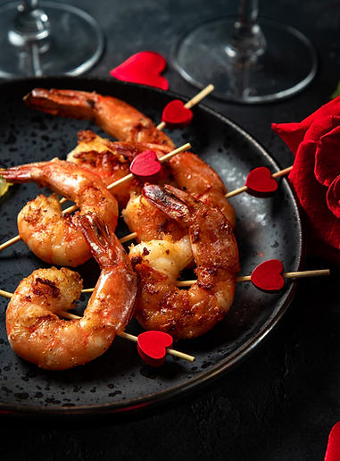 Fried shrimp, roses and champagne. Original appetizer for Valentine's Day, romantic dinner