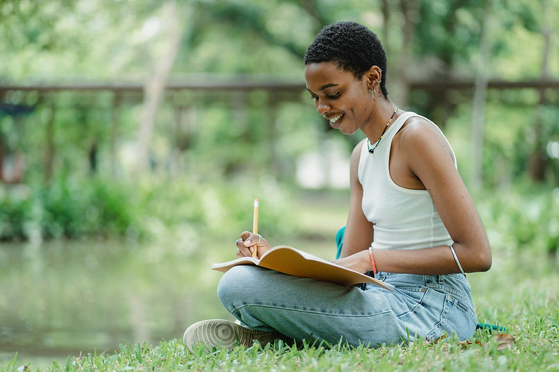 woman writing outdoors