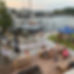 Outdoor back lawn on the river at Seven Sounds Brewery