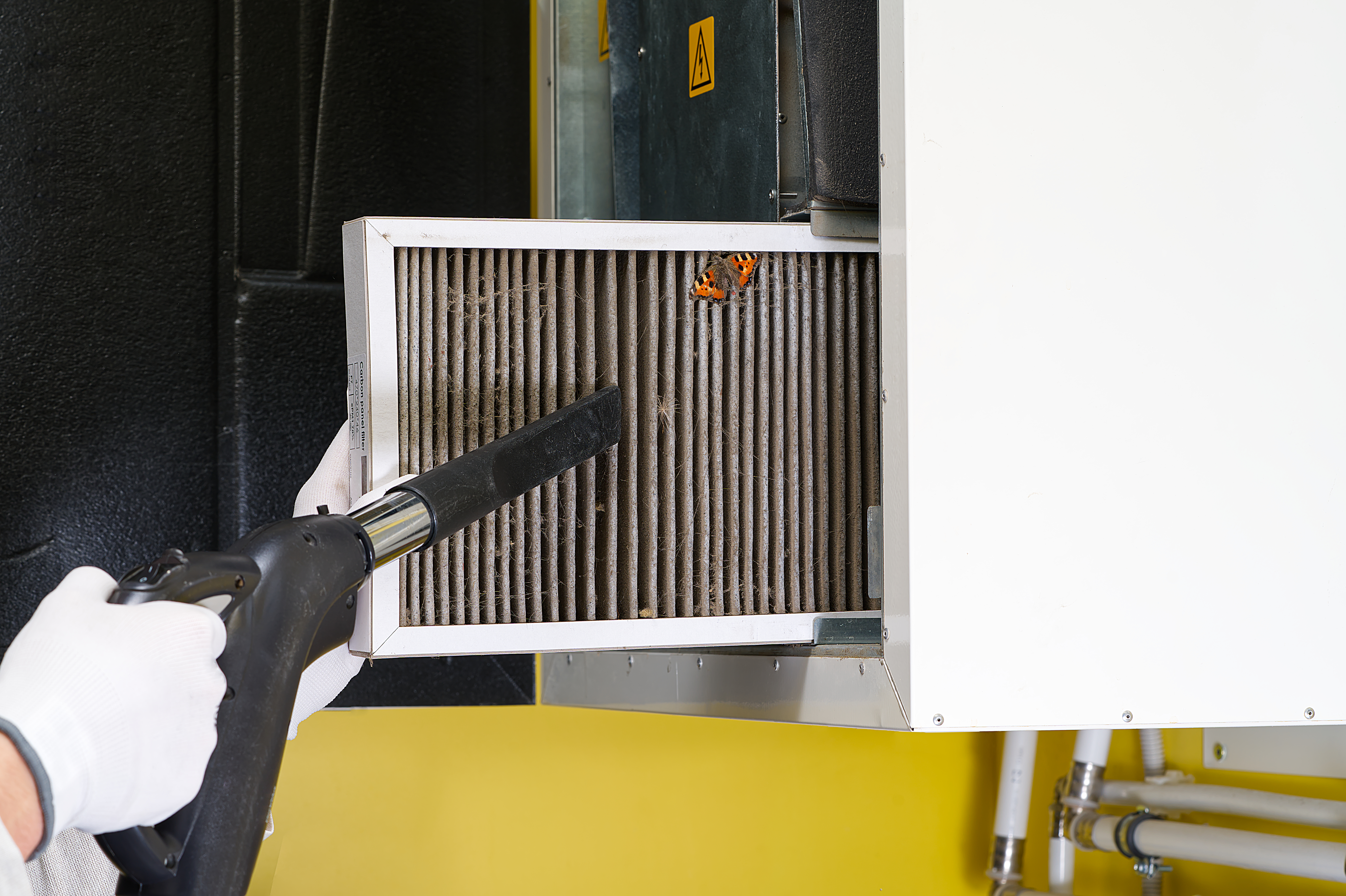 air-filter-cleaning-with-vacuum-in-industrial-sett-2026-03-17-20-10-15-utc.jpg