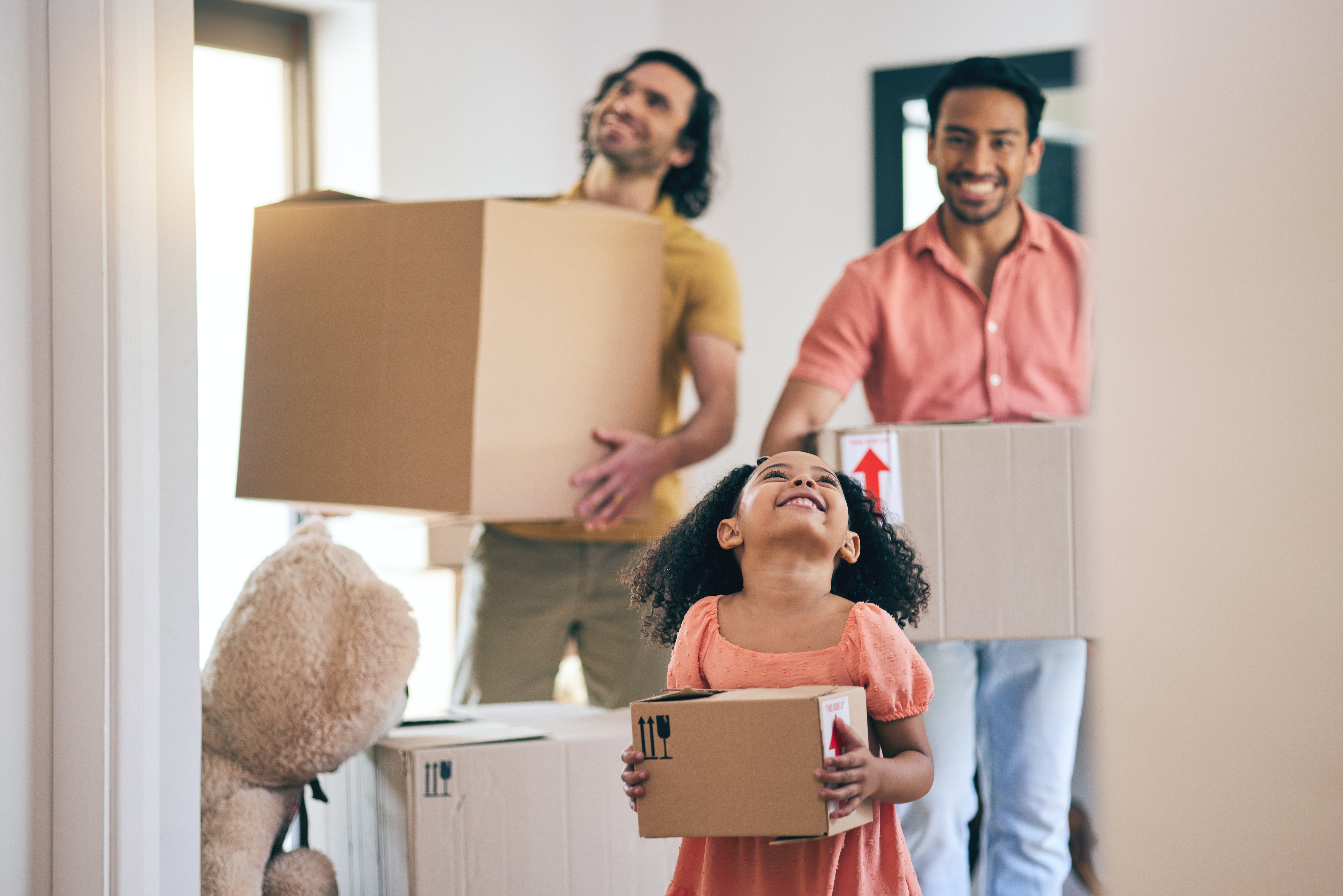 excited-family-moves-into-new-home-together-2026-03-25-05-18-17-utc.jpg
