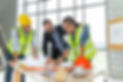 Construction engineer and architect in vest and helmet discussing blueprint with construct
