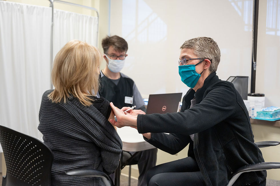CEO Jodi Joyce administering vaccines at a vaccination clinic for Unity Care NW.