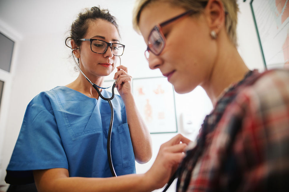 Medical Provider listening to a patient's heart