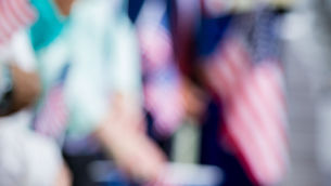 Blurred American flags waving