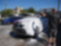 Professional car detailing and hand wash service, close-up of a sparkling clean vehicle with water droplets and shiny paint finish