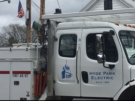 A photo of the Village of Hyde Park Electric Department bucket truck.