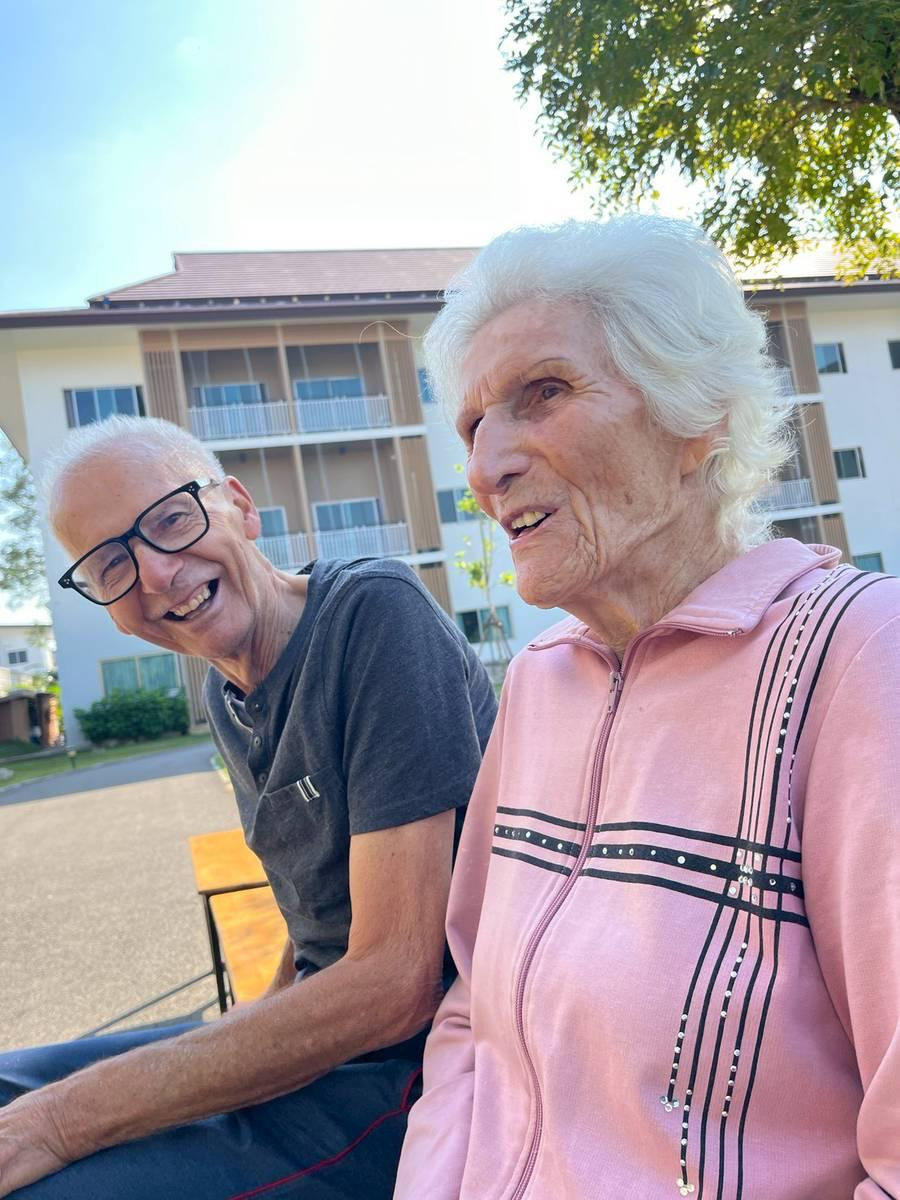 Two residents outside in the garden