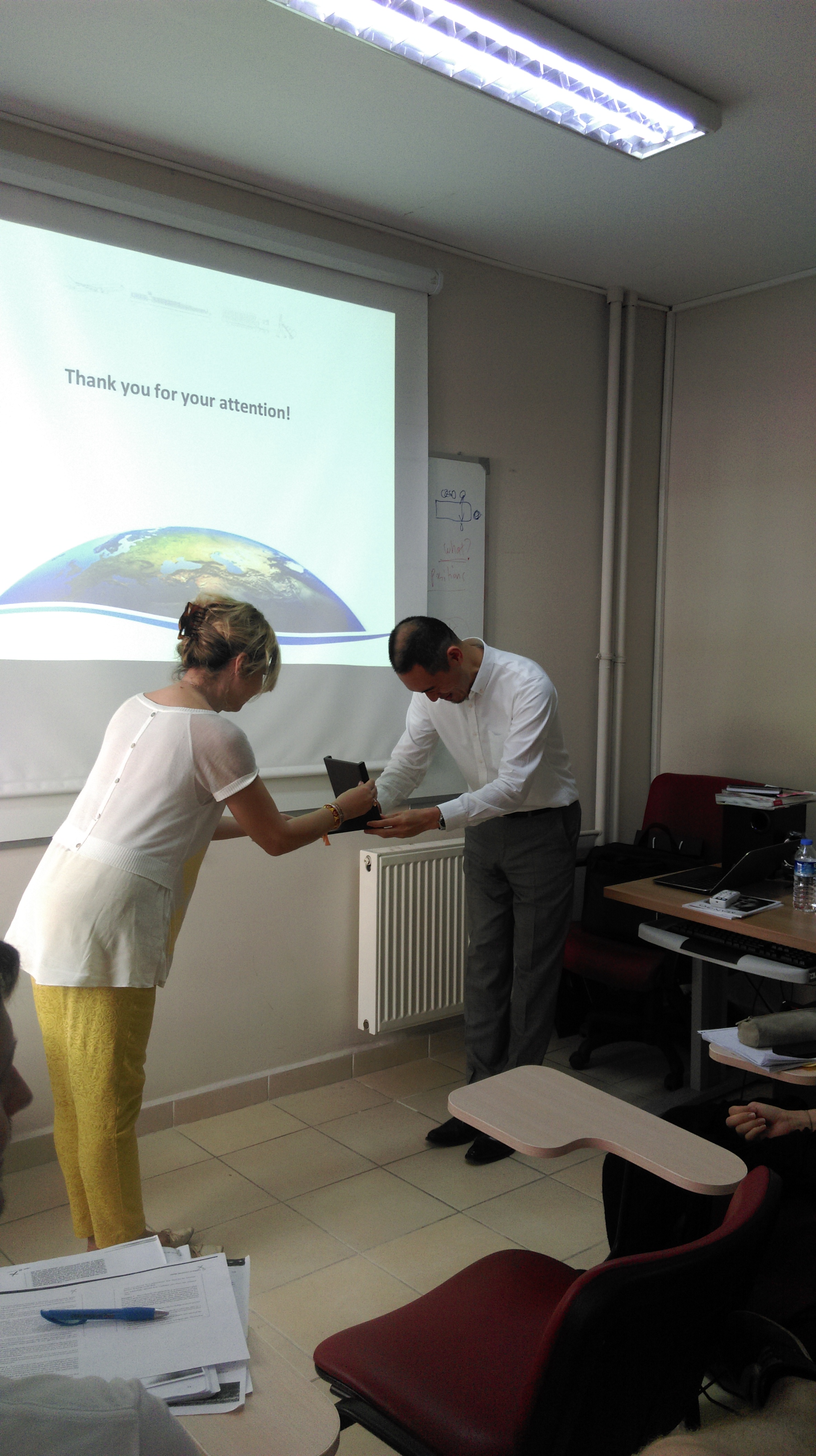 Mr. Kuwabara receiving his plaque