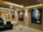 Modern Home Theater With Movie Poster Acoustic Panels -