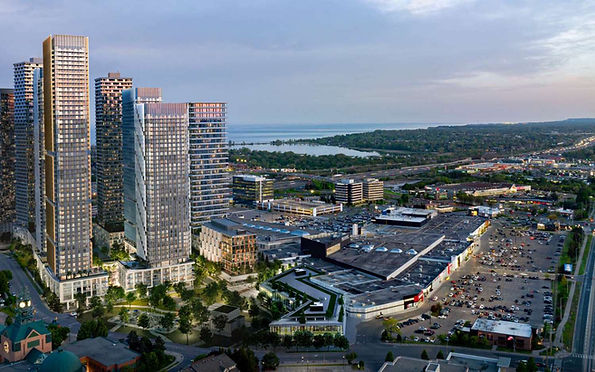 A breathtaking aerial view of Pickering, Ontario, showcasing luxury high-rise condominiums, a major shopping center, and a scenic waterfront along Lake Ontario. Irving Security Corps provides professional security services in Pickering, specializing in residential, commercial, retail and event security.