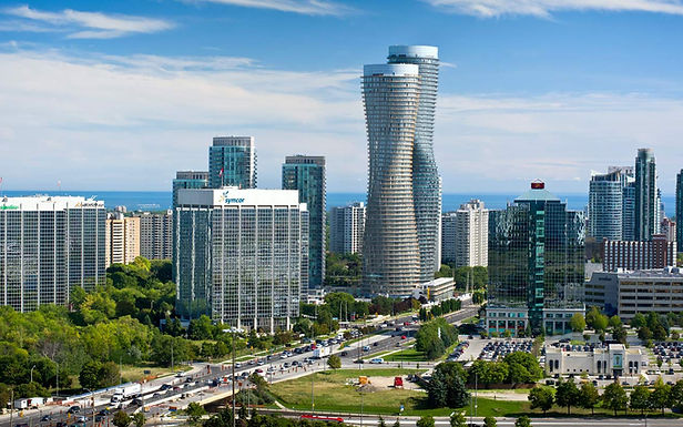 A stunning aerial view of the Mississauga skyline, showcasing the iconic Absoulte World Towers along with surrounding modern high-rises, Irving Security Corps provides expert security services across Mississauga, specializing in residential, commercial, retail and event security.