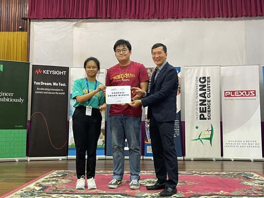 First Tech Challenge Participants and coach receiving award