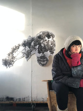 Renata in her studio, behind her, Consuelo's Climber, an ink drawing on acid-free Foamex.