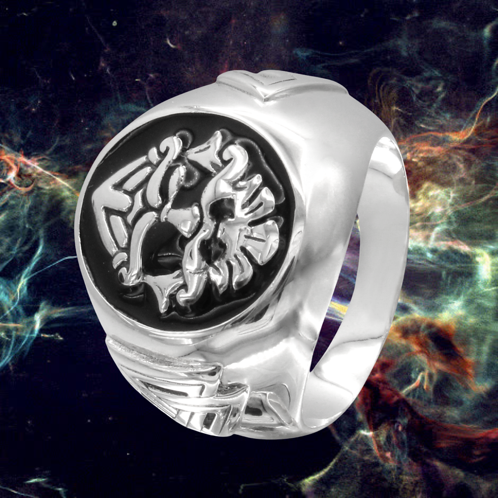 Thumbnail: Silver ring with intricate stylized beast design on black inset.