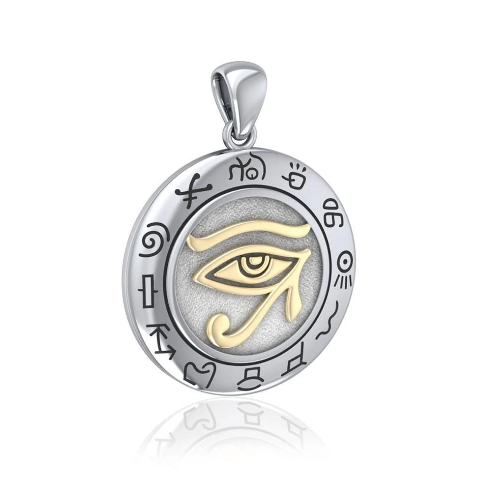 Round silver pendant featuring golden Eye of Horus, an Egyptian symbol.
