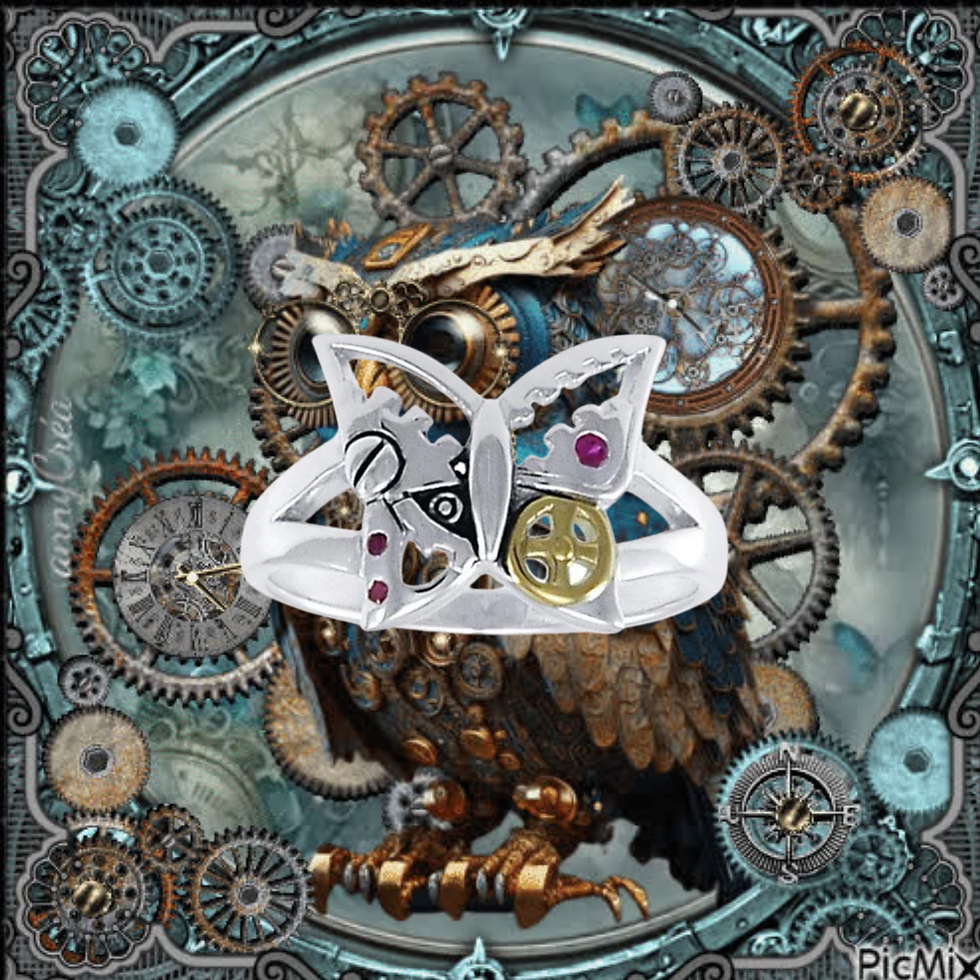 Thumbnail: Steampunk silver ring with gears and jewels over a mechanical owl, PicMix