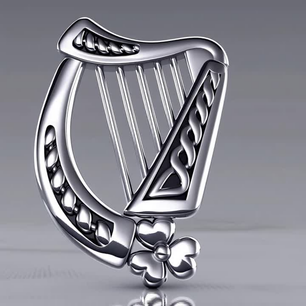 Thumbnail: Silver Celtic harp pendant with intricate knotwork and shamrock detail.