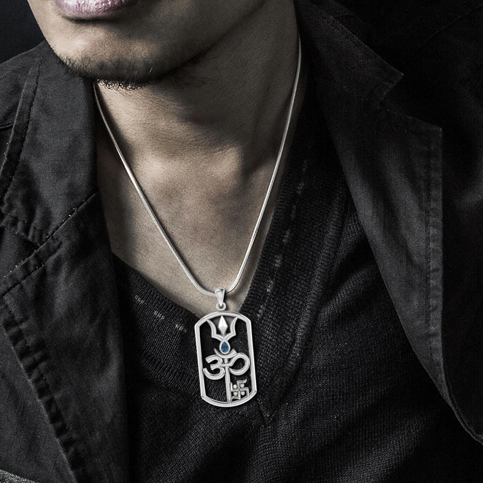 Thumbnail: Man wearing silver Trishul Om Swastik pendant with blue gemstone.