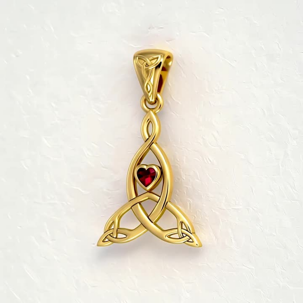Thumbnail: Solid gold Celtic Trinity knot pendant with a vibrant red heart.