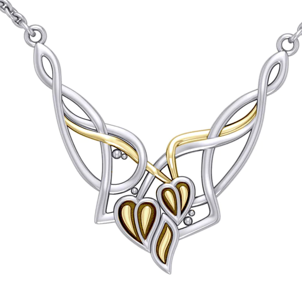 Silver and gold Celtic knot pendant necklace with intertwined heart shapes.