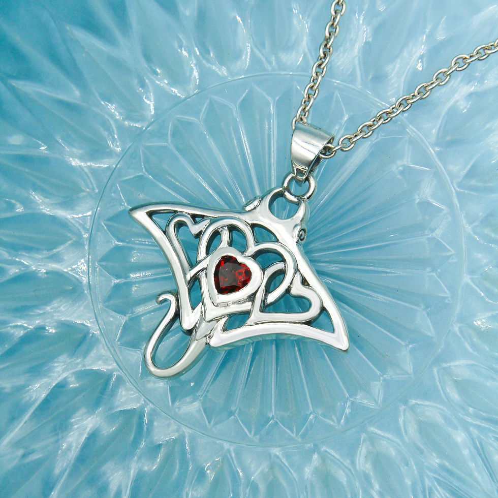 Thumbnail: Sterling silver manta ray pendant, heart shapes, red garnet, blue background.