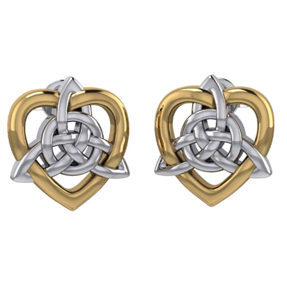 Pair of gold heart, silver Celtic knot earrings on white background.