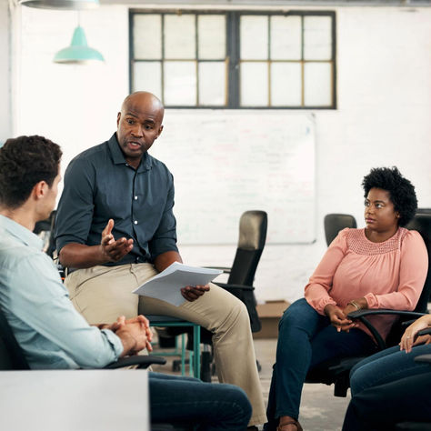 Manager developing communication skills through training to improve team performance