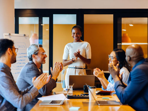 Confident professional leading a discussion in a team meeting setting