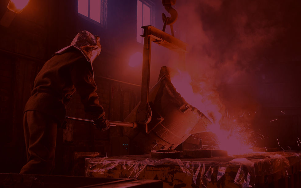 Foundryman pouring metal