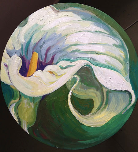 circular acrylic painting of a lily flower with yellow stamen, green background, photographed on dark background