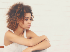 young woman sitting - Are my Symptoms related to my High Sensitivity?