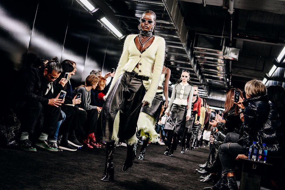 Leather chaps and butcher aprons mixed with tweed suiting in Collection 2 from Alexander Wang. Credit Nina Westervelt for The New York Times