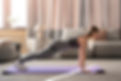full-shot-woman-exercising-yoga-mat-inside.jpg