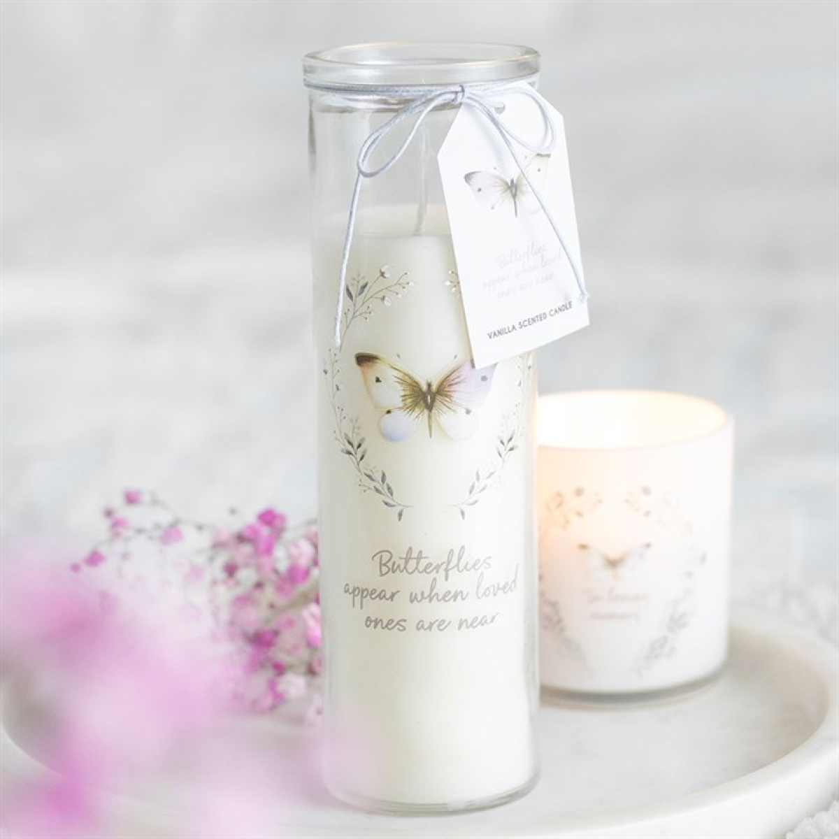 Vanilla-scented memorial tube candle with butterfly design and comforting message